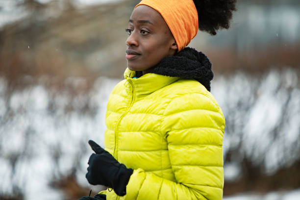 Young African sporty man training on the snow in the park