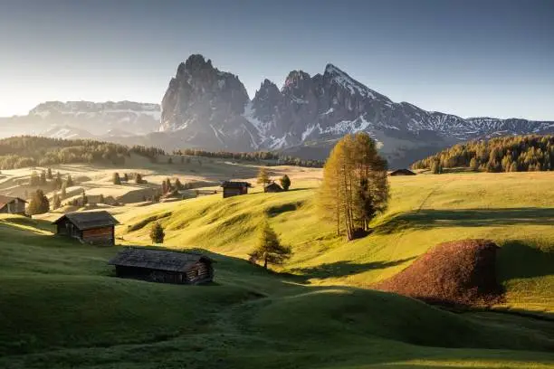 A landscape of Seiser Alm near the Langkofel Group mountains under the sunlight in Italy