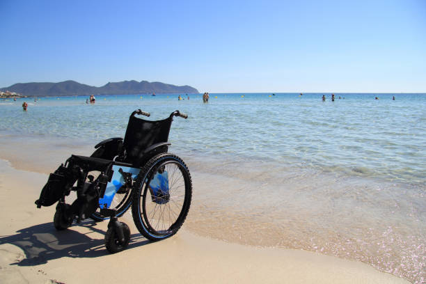an empty sports wheelchair on the beach