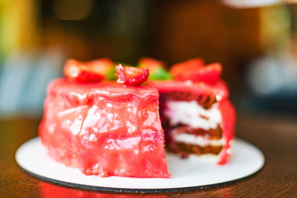 Strawberry Cake, eggs, flour and rolling pin isolated on white background.