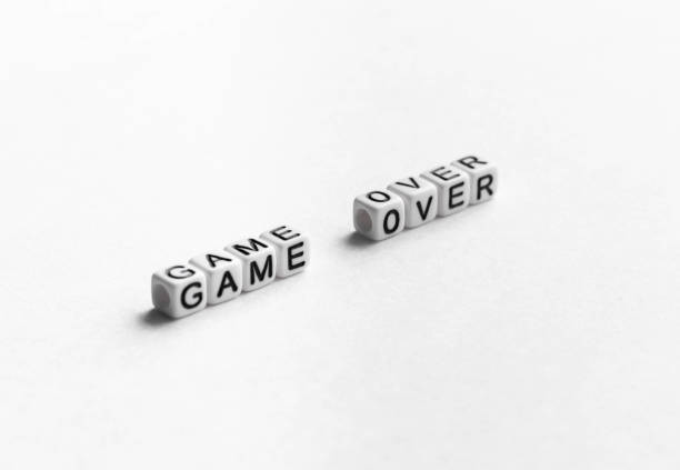 istock White plastic cubes with letters on them arranged in the words game over 1439278784