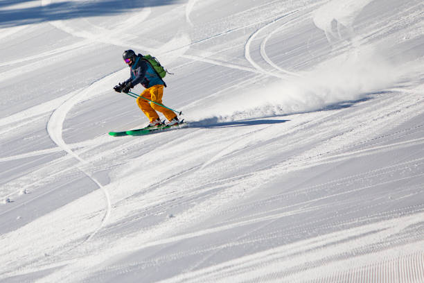 istock Young man skiing in mountains at ski resort 1439279217