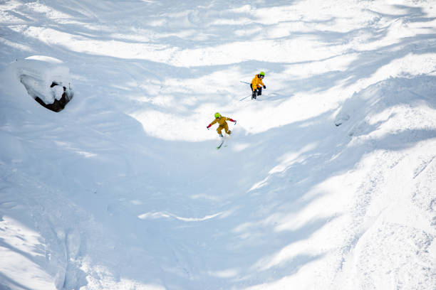 istock Brothers skiing in mountains at ski resort 1439279341