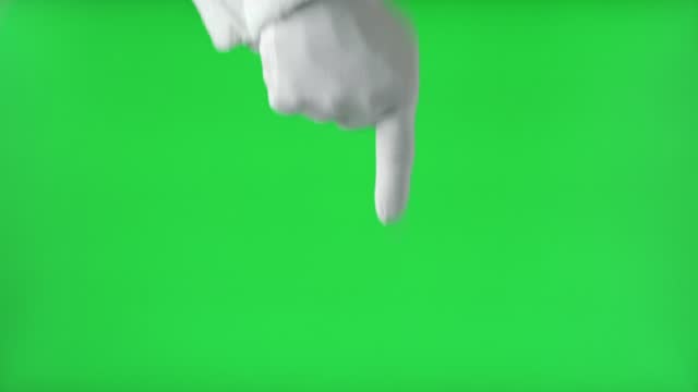 Santa Claus Hand Pointing at Something with Index Finger Isolated On Green Background. Close Up. White Gloved Hand Points Down with one finger. Chroma Key Screen. Advertisement gesture.