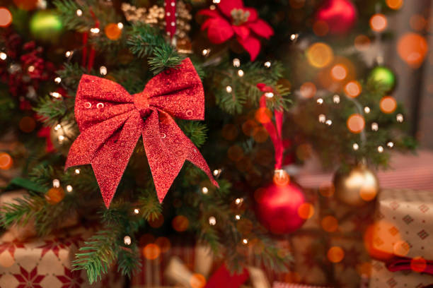 istock Close-up red bow on Christmas tree 1439282716