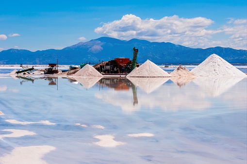 A beautiful shot of a sand mine surrounded with reflective water
