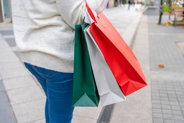 istock woman in town shopping 1439283538