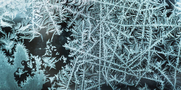 frost pattern on glass. ice background. copyspace. cold weather. climate. frost - frosted glass window frost ice imagens e fotografias de stock