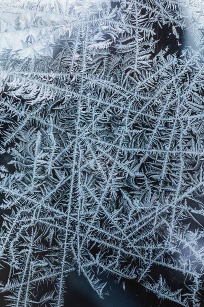 istock Frost pattern on glass. Ice background. Copyspace. Cold weather. Climate. Frost 1439290431