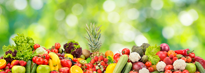 Collage fresh vegetables, fruits, berries on green background. Healthy food concept