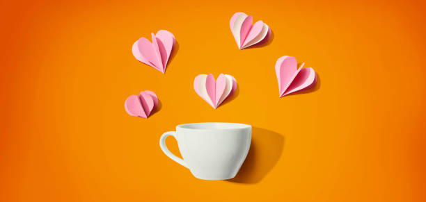 istock Coffee cup with paper craft hearts 1439291719