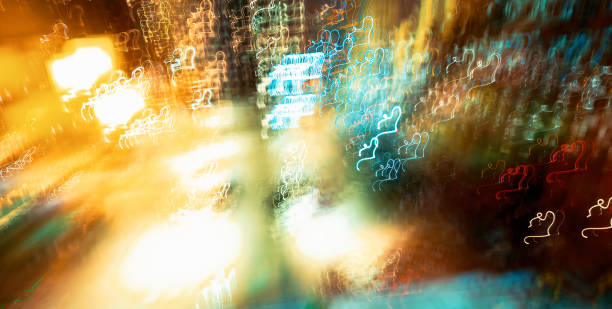 istock Abstract blurred cityscape neon lights background 1439291735