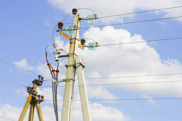 istock Electric poles with wires on the sky 1439298600