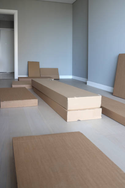 istock Cardboard boxes and packed chair in home. 1439300537