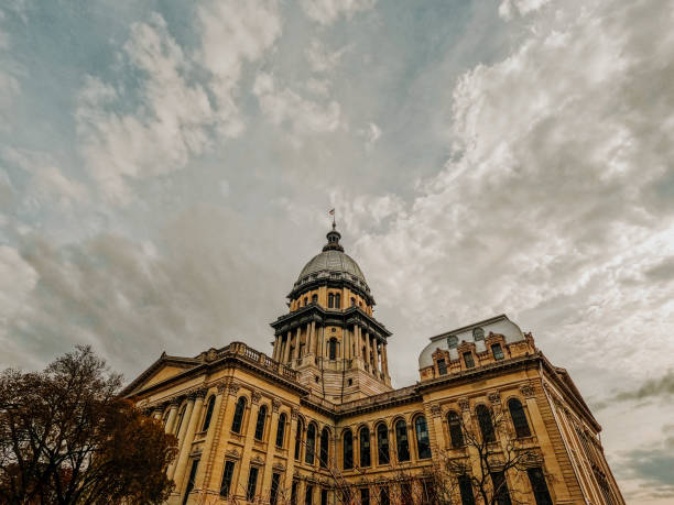 The Illinois State Capitol Building Rear view of the Illinois State Capitol Building under a dramatic cloudy sky. Fall leaf color in the forefront of view. Located in Springfield, Illinois, USA. illinois state capitol stock pictures, royalty-free photos & images