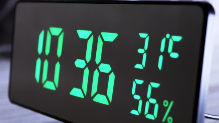 Digital Clock Showing Time on Green Display 10:36 AM, Temperature, Air Humidity