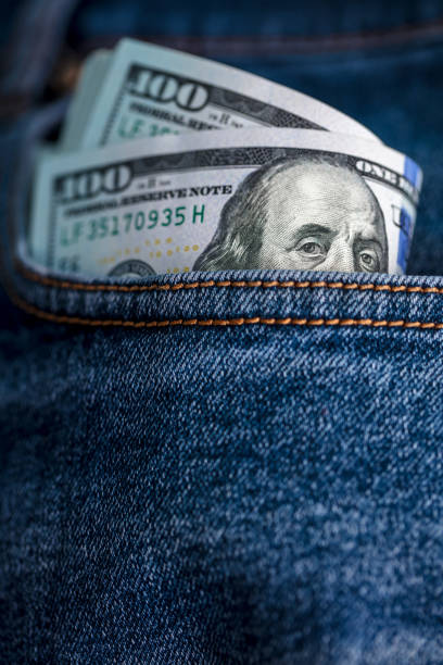 istock Dollar bills in jeans pocket 1439307632