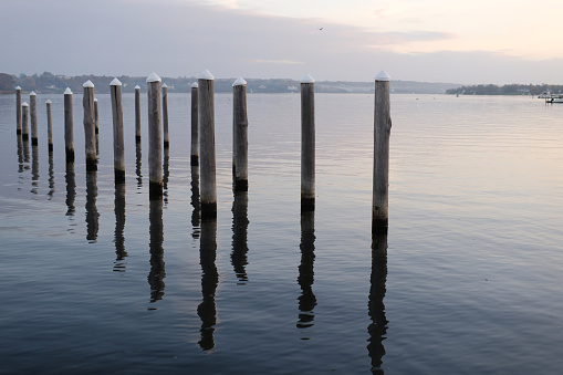 Empty dock pillings during wintertime in NJ state.