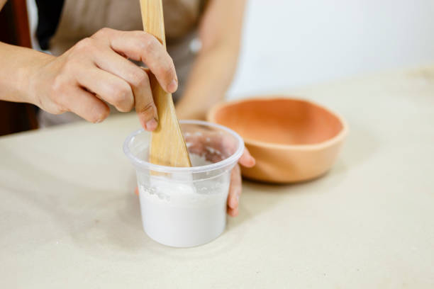 istock Japanese potter painting a clay bowl 1439308861