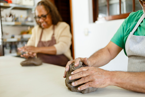 middle-aged people in a pottery class