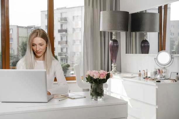 istock Woman administrator on reception talking with client on phone making appointment 1439311281