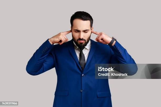 Bearded Man Covering Ears Annoyed By Unpleasant Noise Loud Voices Difficult To Listen High Sound Stock Photo - Download Image Now