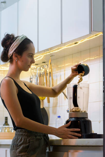 istock Girl preparing food at home 1439312468