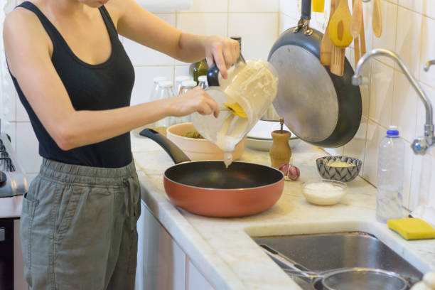 istock Girl preparing food at home 1439314358