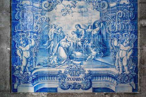 Porto, Portugal - Feb 5, 2020: Portuguese Azulejo tiles with Saint Catherine scene at Capela das Almas de Santa Catarina (Chapel of Souls) Interior - Porto, Portugal
