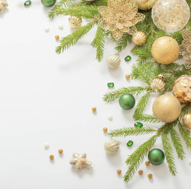 istock golden and green  christmas decorations  on white  background 1439326879