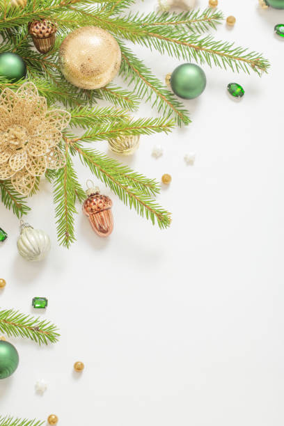 istock golden and green  christmas decorations  on white  background 1439326884