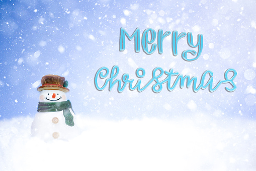 Merry Christmas card with snowman in the snow