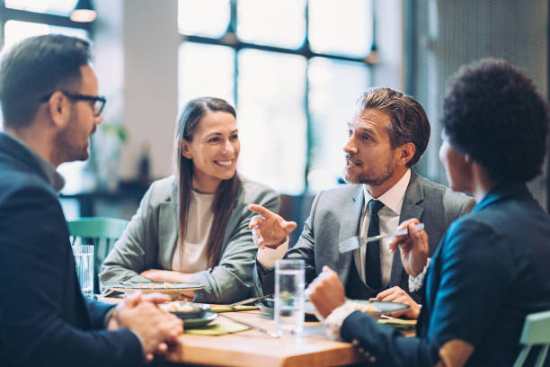 istock Business people having a discussion in a restaurant 1439330614