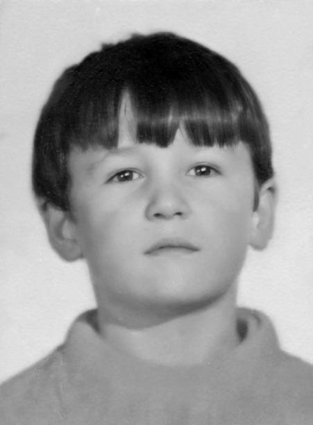 Image taken in the 60s: mug shot of a little boy Image taken in the 60s: mug shot of a little boy high school photos stock pictures, royalty-free photos & images