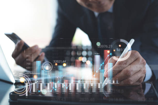 istock Businessman analyzing financial data, economic growth graph chart on digital tablet. Business planning and strategy. Analysing trading of exchange, financial report. 1439339614
