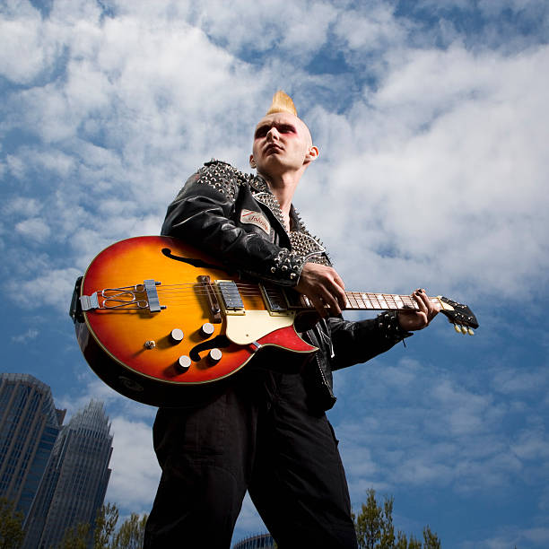 Punk male playing guitar.