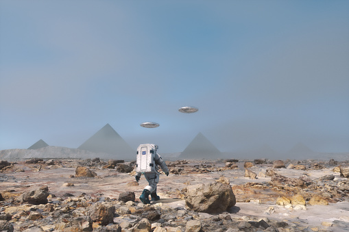 Astronaut walking towards mysterious pyramid on distant planet. 3D generated image.