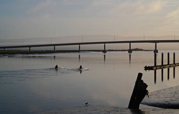 Two Rowers at Sunrise in Eureka, California.  Rowers heading toward Aradia Bay.