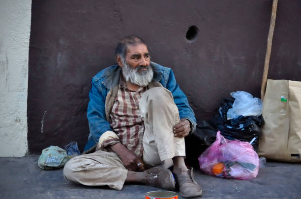 Homeless man Guanajuato city. March 6, 2014: Homeless man waiting in the street for visitors' charity during WRC 2014 in Guanajuato Historic Downton tramp home stock pictures, royalty-free photos & images