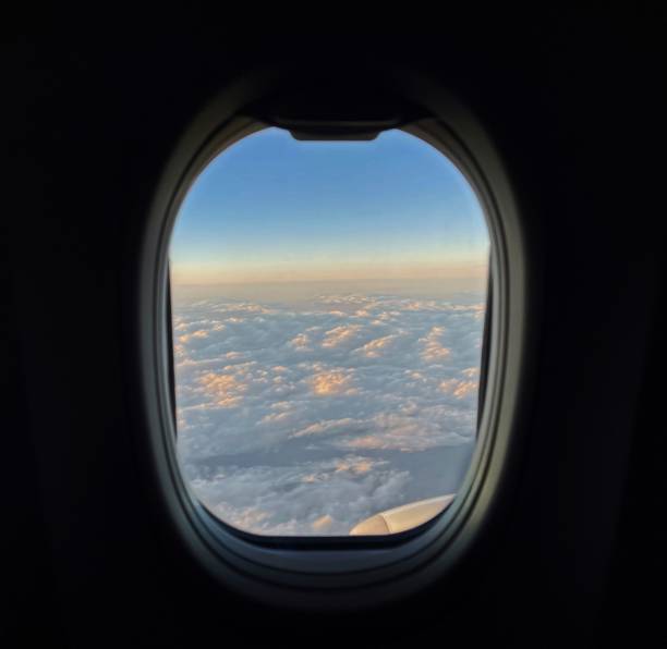 istock View of Cloudy and hazy Skies From Plane Window 1439349416