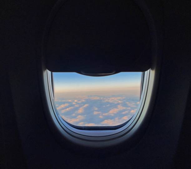 istock View of Cloudy and hazy Skies From Plane Window 1439349422