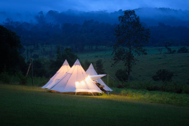 istock Glowing yellow tent in the mountains 1439352421