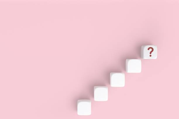 istock Questions Mark word in cube block on pink background. FAQ Answer, Q&A. Copy space. 3D rendering 1439360680