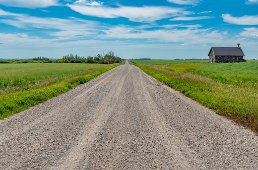 Country road leading to Foster School, built of fieldstone in 1897, outside Abernethy, SK