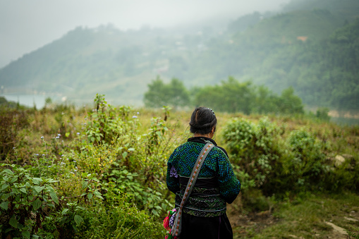 Hill Tribe Woman in Sapa, Vietnam with Mountains