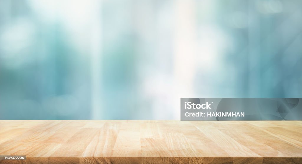 Selective focus.Top of wood  table with window glass and cityscape background. Selective focus.Top of wood  table with window glass and cityscape background.For montage product display Table Stock Photo