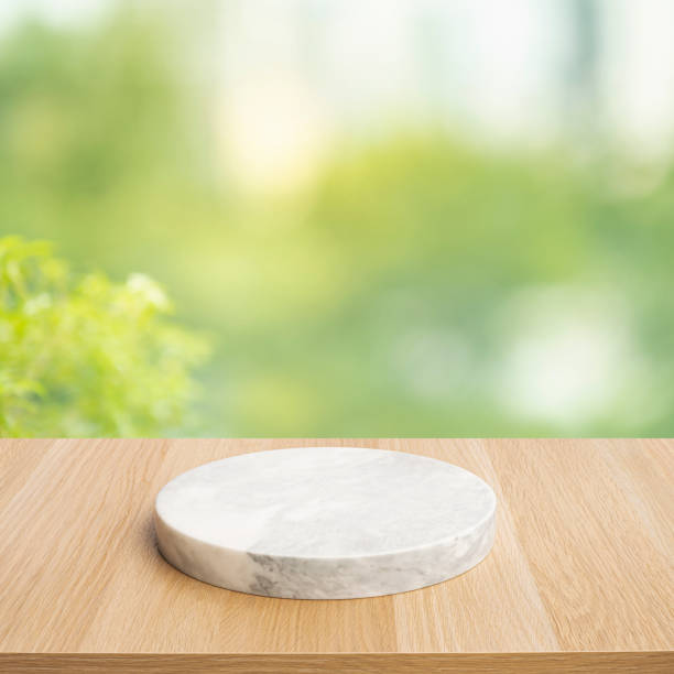 istock Selective focus.Marble table,chopping board on top wood with blur window glass background 1439372229