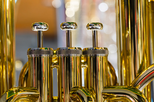 Upper angle view of brass trumpet with black and white variations 3d rendering