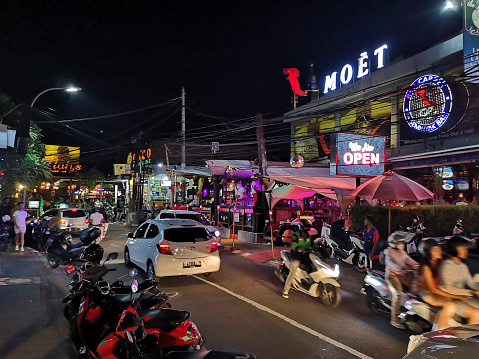 Crowded street by night in Seminyak, a famous tourist area on the west coast of Bali, Indonesia