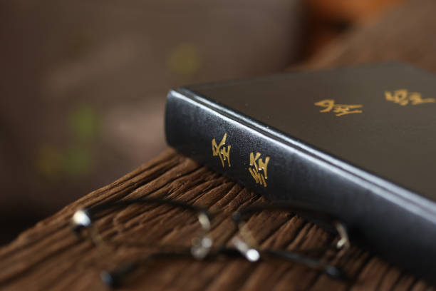 istock Open Holy Bible on a old wooden table 1439391861